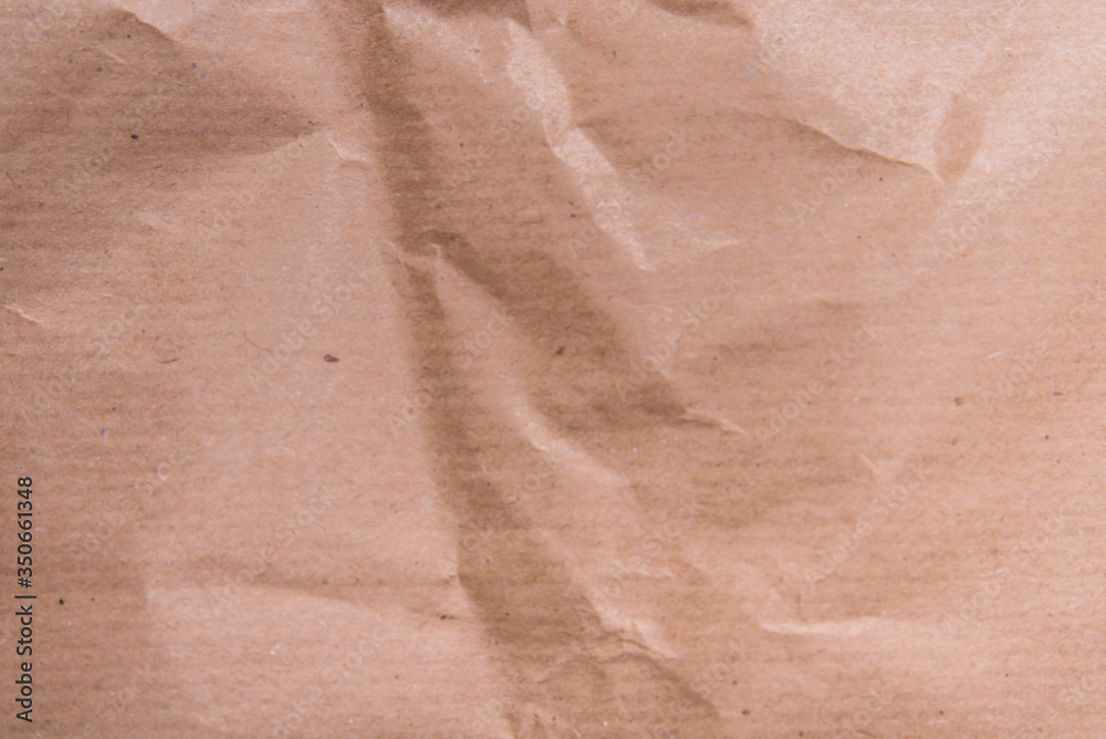 Fototapeta premium Brown crumpled packaging paper textured background