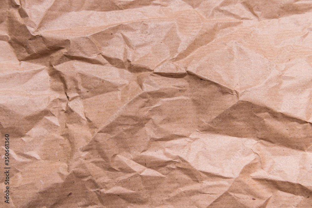 Brown crumpled packaging paper textured background Brown crumpled packaging paper textured background