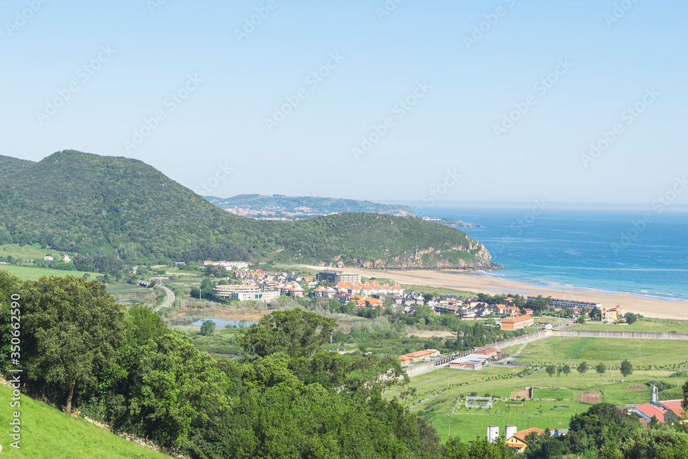 mountain scene with ocean and beach views