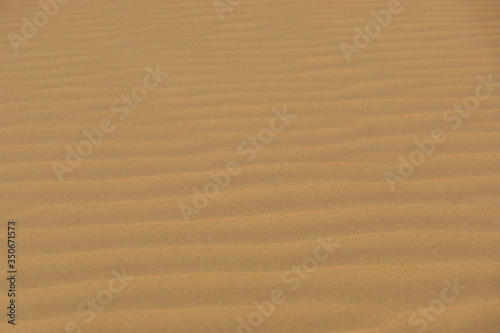 Waves of beach sand background 