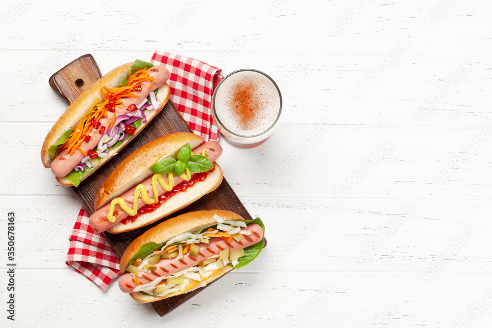 Various hot dog with vegetables, lettuce and condiments Various hot dog with vegetables, lettuce and condiments