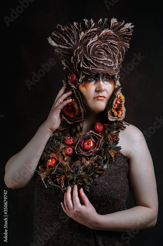 Photos A woman in a fairy-tale costume made of felt