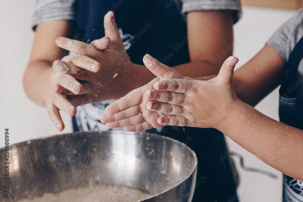 Siblings in the kitchen have fun