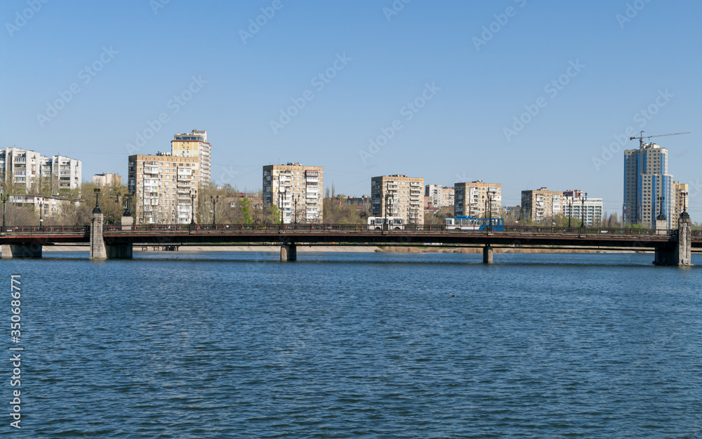 View of the embankment of the Kalmius river and bridge over it in Donetsk. Ukraine. DPR.