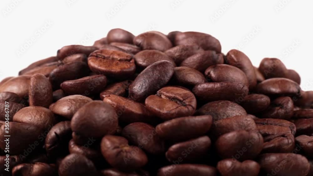 Coffee seeds of spin around themselves on white background Coffee seeds of spin around themselves on white background