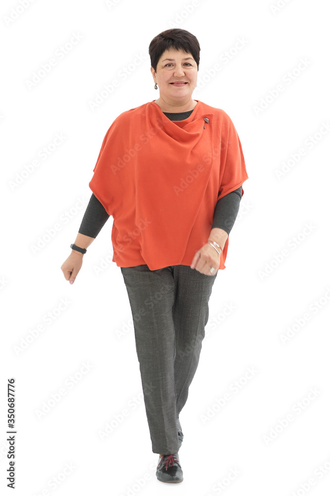 Fototapeta premium Smiling woman walking towards the camera