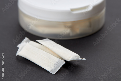 фотографія snus tobacco pouch product over black background