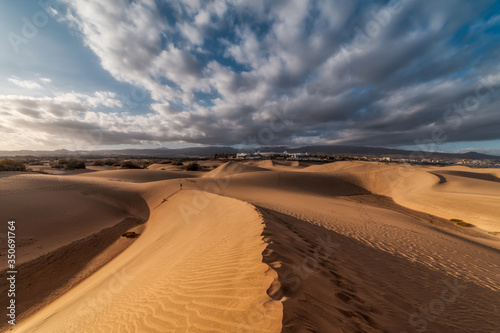 vista de playa del Ingles desde las dunas de Maspalomas al atardecer  Gran Canaria   