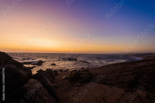 Tourism trip to Portugal, Porto, famous for the Capela do Senhora Pedra. Amazing cliff rocks on the Atlantic ocean west coast of Portugal in Alentejo region at sunset