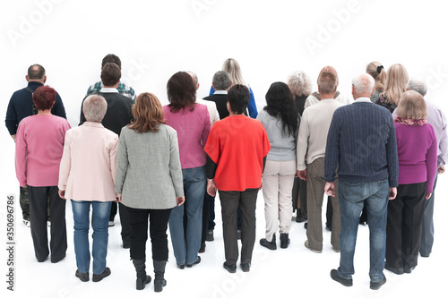 Rear view of a casual group of people looking on blank