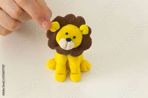 Making lion animal step by step with play dough for children's activity in the school art lesson and plasticine concept.