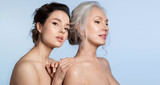 Elderly woman and young woman with perfect skin and different age generation