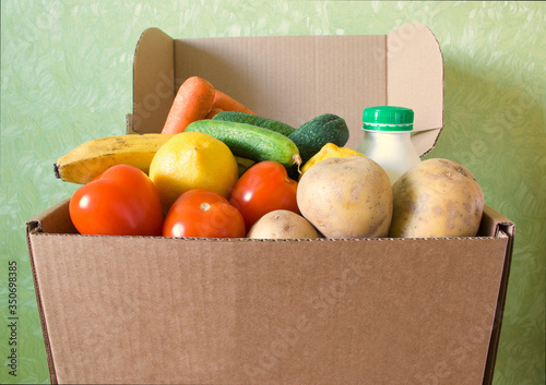Opened box filled with food stuff. Delivery concept. Safe online shopping. Copyspace. Indoors.