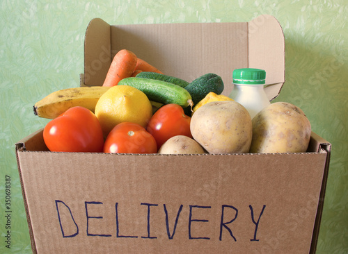 Opened box filled with food stuff. Delivery concept. Safe online shopping. Indoors.