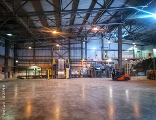 Pallet racks inside a cement plant. Loading shop of cement plant.