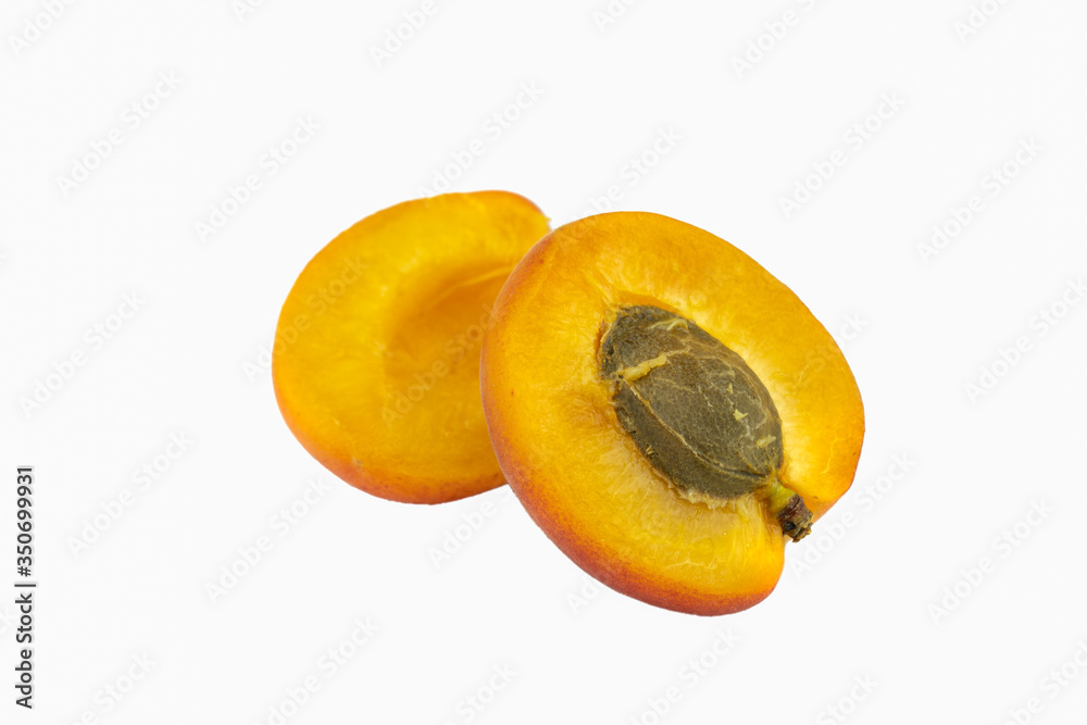 Fresh apricot isolated on white background. One sliced apricot on white