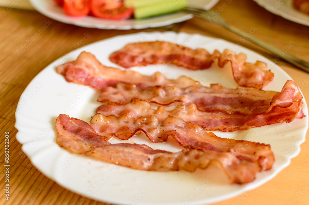 Freshly baked bacon on a blurred background Freshly baked bacon on a blurred background