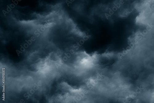 Stormy rain big fluffy clouds. Dark sky. Natural scenic abstract background. Weather changes backdrop. Sky filled with voluminous clouds.