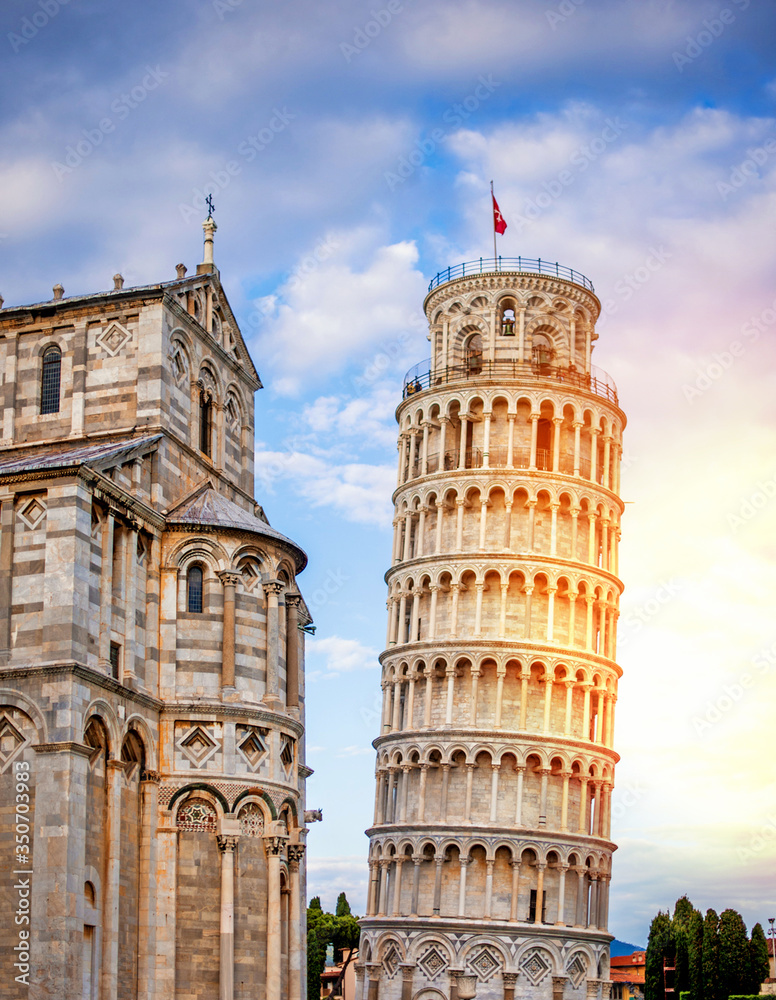 The baptistery at the Piazza Dei Miracoli with the famous Leaning Tower and the dome, Pisa, Tuscany, Italy, Europe at the sunset. The Leaning Tower of Pisa, reestanding bell tower