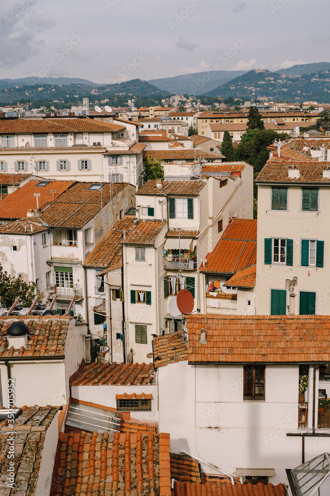 Aerial view of rooftops and buildings in the city of Florence, Italy.
