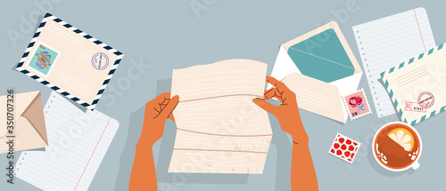 Wallpaper Mural Hands holding a letter. Envelopes, post stamps and postcards on the table. Top-down view.  Modern vector illustrated banner, card design. Correspondence and postal delivery concept. Torontodigital.ca