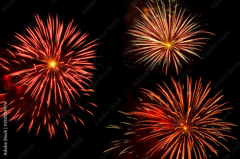 colorful bursts of fireworks trio against black sky