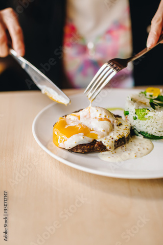 poached egg on steak with rice garnish