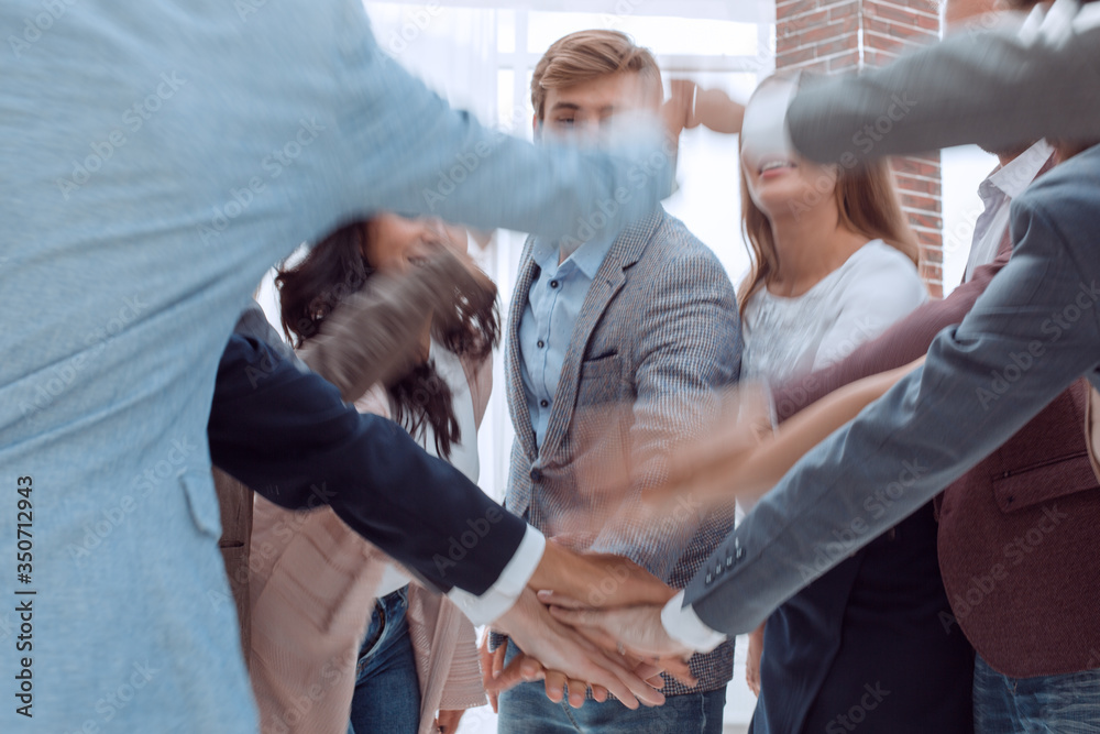 close up. young business team showing their unity. close up. young business team showing their unity.