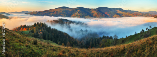 foggy morning in the mountains. Autumn sunrise in the Carpathians © sergnester