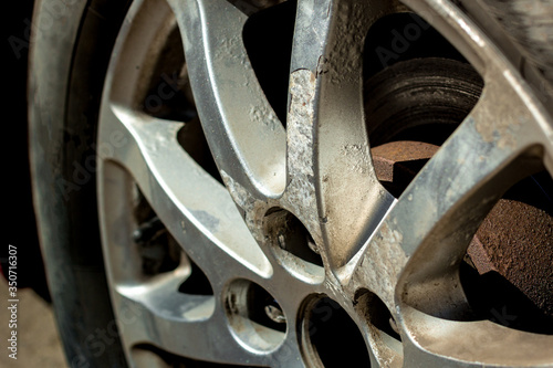 Corrosion of car rims. Peeling paint from metal. Chemical reaction. Disk recovery. Prolonged use.