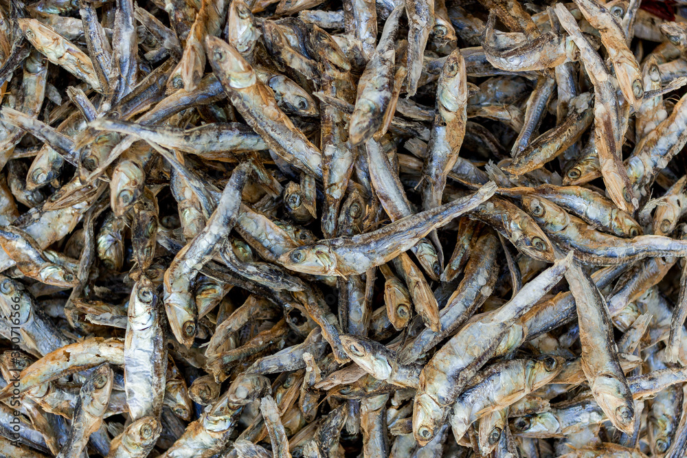 Dried Small fish used in Asian cuisine. Top view, texture, background