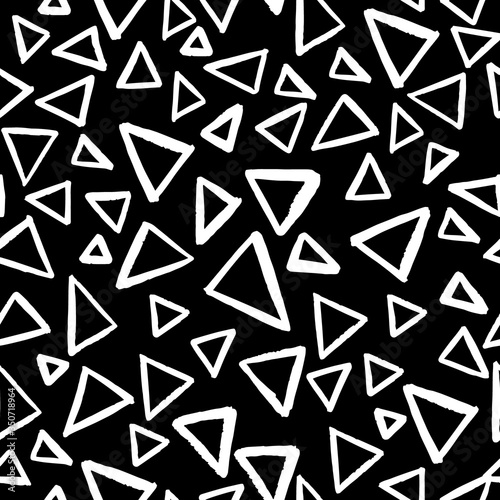 Seamless vector pattern with isolated outline triangles on black background in doodle style
