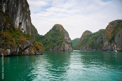 Halong Bay, Vietnam, with limestone hills. Dramatic landscape of Ha Long bay, a UNESCO world heritage site and a popular tourist destination.