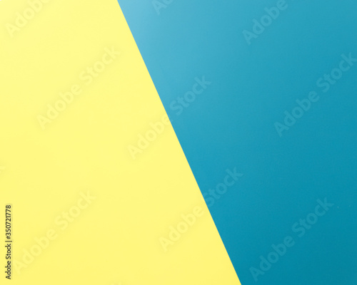 Paper background.Half of the background is yellow, the other half is blue.