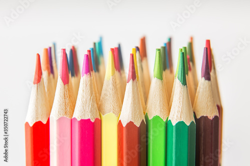 Colorful wooden pencils isolated on white background.Close up