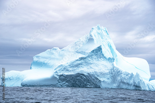 Iceberg Mountain in Iceberg Alley at Sea with blue streaks of Bubble Free Ice