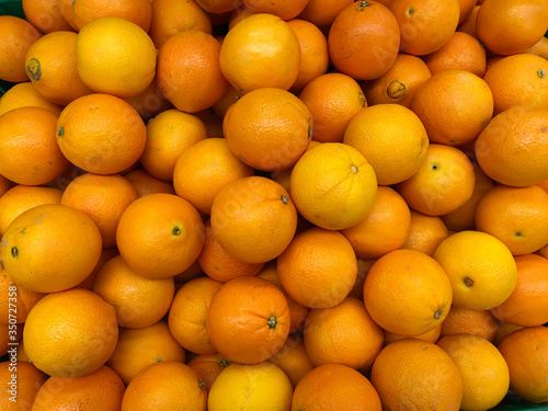 Close-up oranges fruits in a supermarket, food and retail concept
