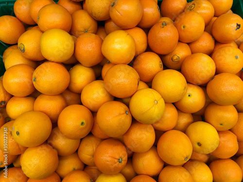 Close-up oranges fruits in a supermarket  food and retail concept