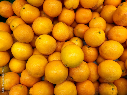 Close-up oranges fruits in a supermarket  food and retail concept