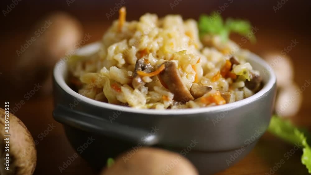 vegetarian cooked rice with mushrooms in a ceramic bowl vegetarian cooked rice with mushrooms in a ceramic bowl