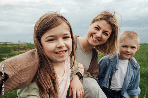 Mom with children for a walk in the field