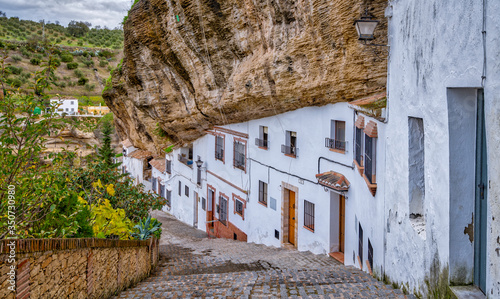 The homes built under a protruding rock face in Setenil de las bodegas Spain