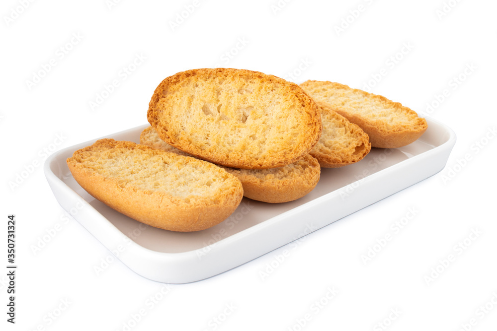 Crispy biscottes, french toast bread on white plate, on white background
Crispy biscottes, french toast bread on white plate, on white background