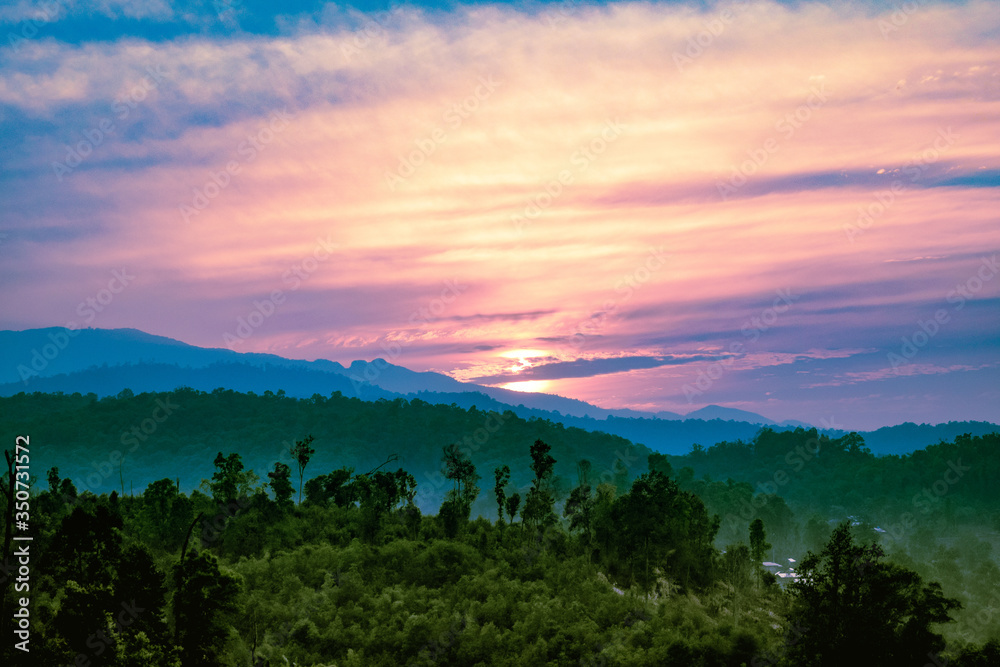 sunrise over the jungle mountains Thailand sunrise over the jungle mountains Thailand