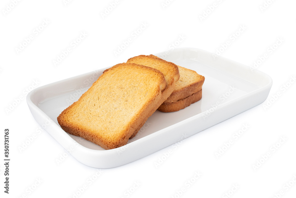 Triple crispy biscottes, square cracker on white plate, on white background (Tr- etimek) Triple crispy biscottes, square cracker on white plate, on white background (Tr- etimek)
