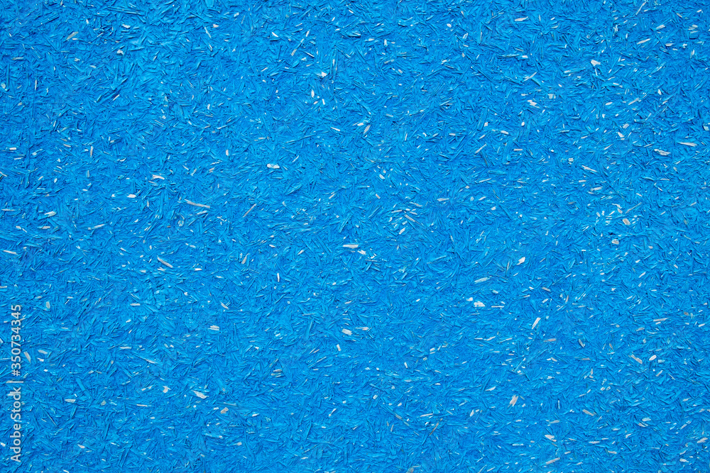 texture of pressed sawdust. Particleboard is painted in blue.