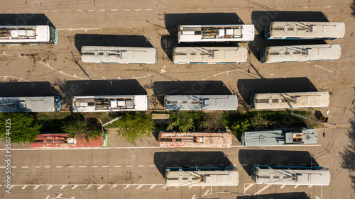 Obraz na plátně Many trolleybuses parked in front of the trolley depot hangar