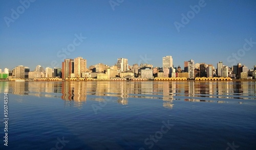 Panoramic view of Porto Alegre cityscape and the Guaíba lake on a sunny day.