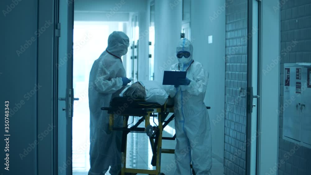 Paramedics are checking up a patient in the corridor Paramedics are checking up a patient in the corridor