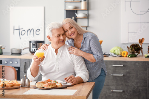 Happy elderly couple having...